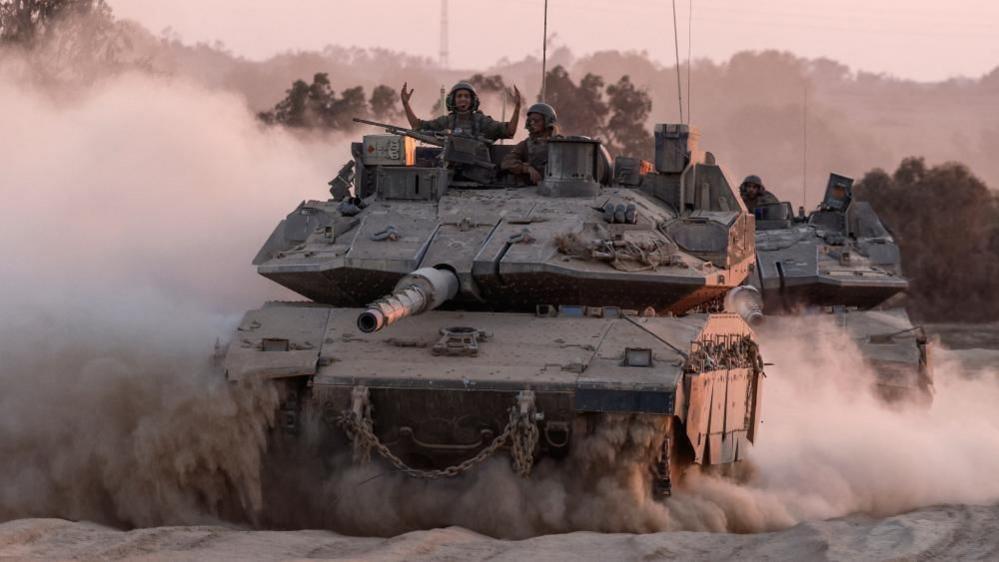 Israeli soldiers in a tank near the Gaza border (file photo)