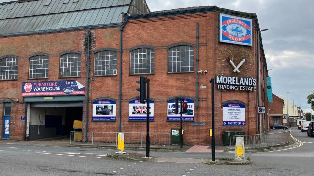 Exterior view of Moreland's Trading Estate, with a sign advertising the building