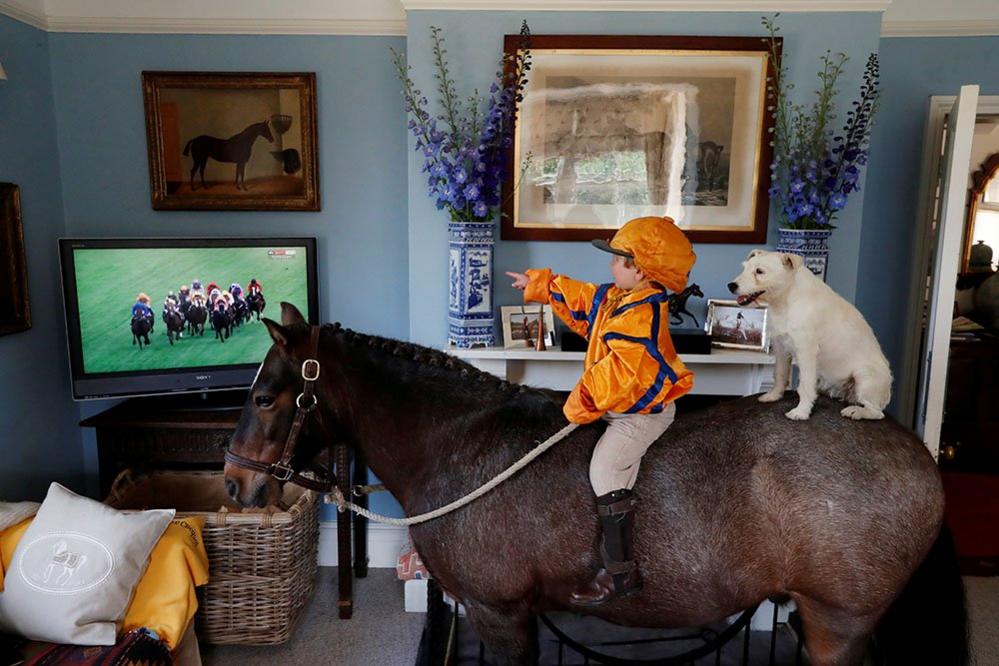 Merlin Coles on his horse inside the house