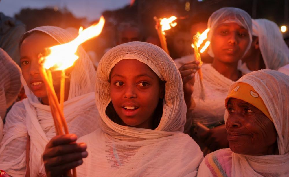 Ethiopian Orthodox faithful hold candles during the Meskel festival celebration to commemorate the discovery of the True Cross on which Jesus Christ was crucified, in Addis Ababa, Ethiopia, September 26, 2024