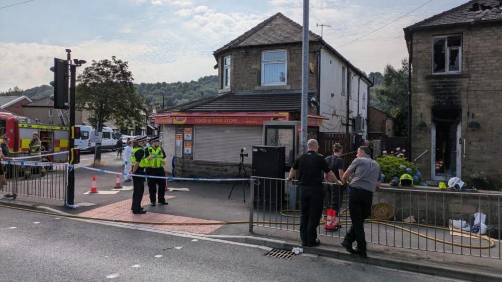 Investigations continue at the scene of the blaze in Huddersfield