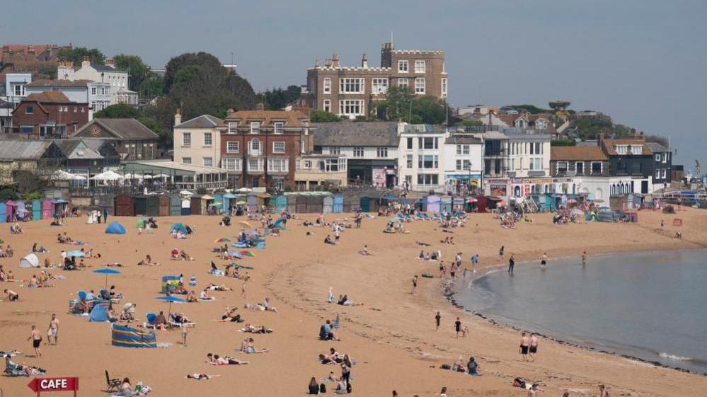 People relaxing on the beach in Kent