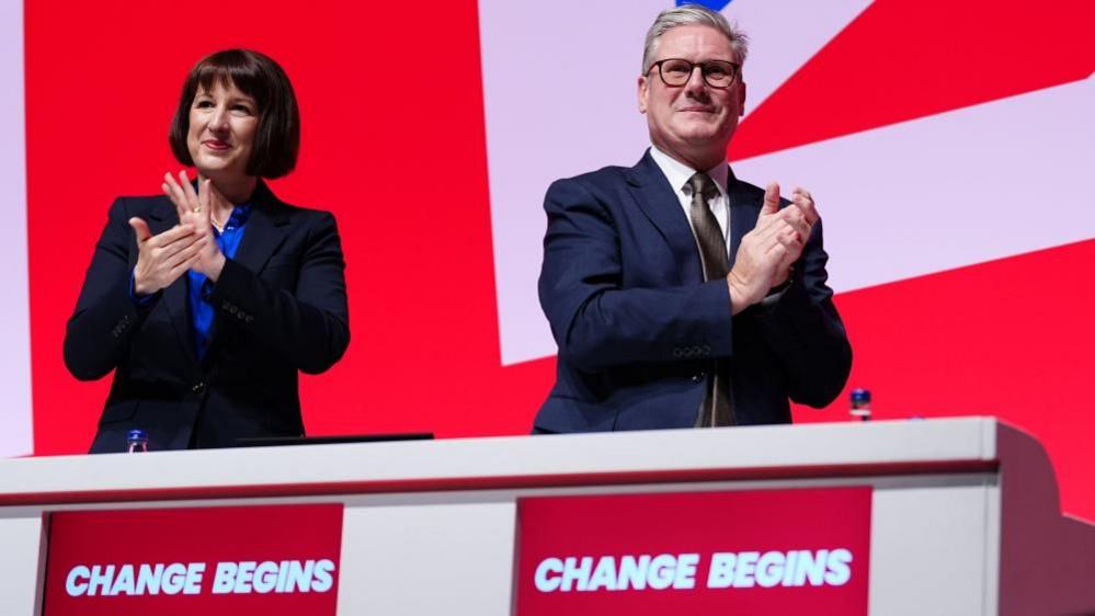 Rachel Reeves and Keir Starmer clap