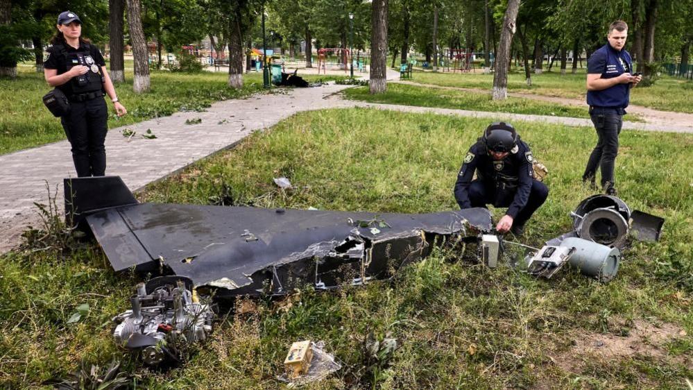 Ukrainian experts inspect drone debris after a strike on Kharkiv in the north-east of the country. Photo: June 2025