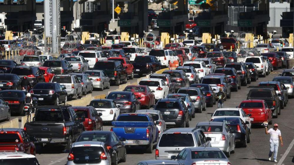 Cars queuing to enter the US from Mexico