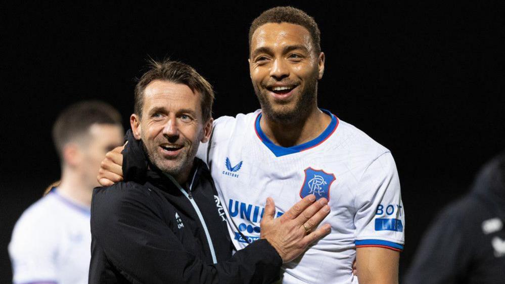 Cyriel Dessers with Neil McCann