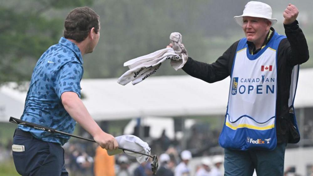 Dougie MacIntyre celebrates after his son Robert wins the Canadian Open