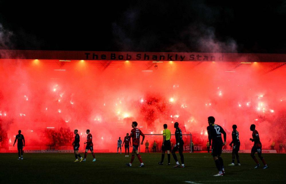 Rangers fans light up the Bob Shankly stand with bright red pyro that creates big plumes of smoke