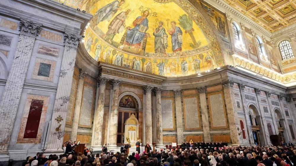 A full congregation sat in the gold-gilded Sistine Chapel