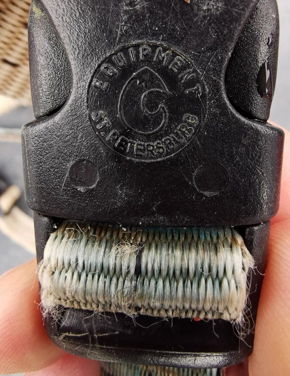 A harness clip that says "Equipment St. Petersburg"