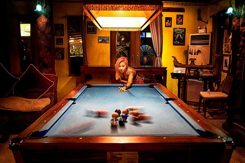 Woman playing pool