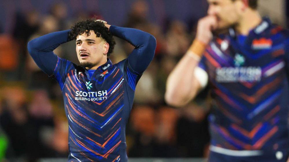 Edinburgh's Mosese Tuipulotu looks dejected