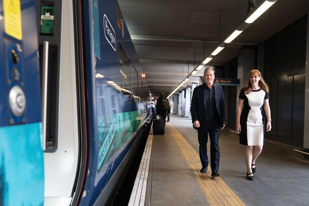 Labour leader Sir Keir Starmer and deputy Labour Party leader Angela Rayner board a train to Selby, North Yorkshire