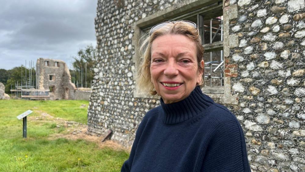 Jo Brannigan standing near the wool factory, which is part of Baconsthorpe Castle