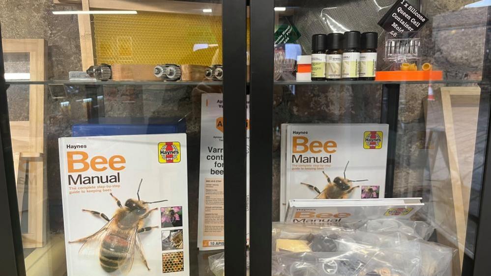 Some of the products on offer in a display cabinet at the Beekeepers Café in Redhill, Bristol