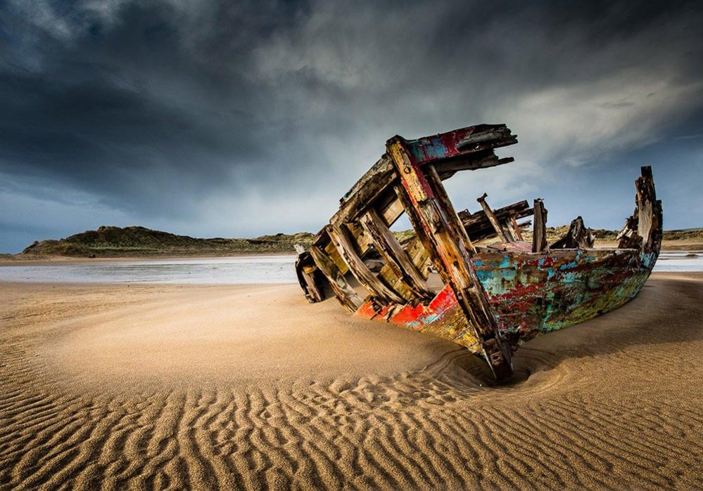 Derelict boat on the shore