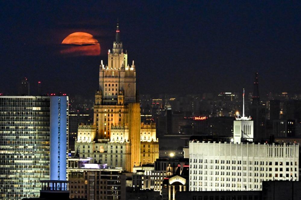 Full Moon rises over Russian Foreign Ministry building in Moscow, Russia on July 3, 2023