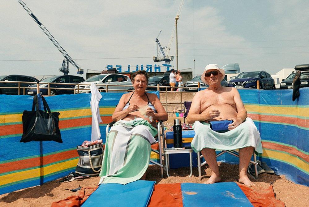 A couple eating lunch on Paignton Sands