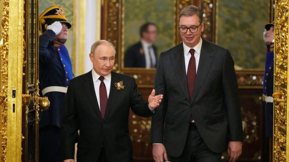 Russian President Vladimir Putin and Serbia's President Aleksandar Vucic enter the hall during their meeting in Kremlin, Moscow, Russia, Friday, May 9, 2025
