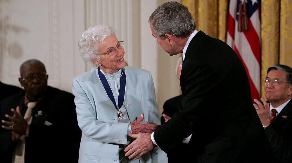 George W Bush presents the Presidential Medal of Freedom to Ruth Johnson Colvin in the East Room of the White House in 2006