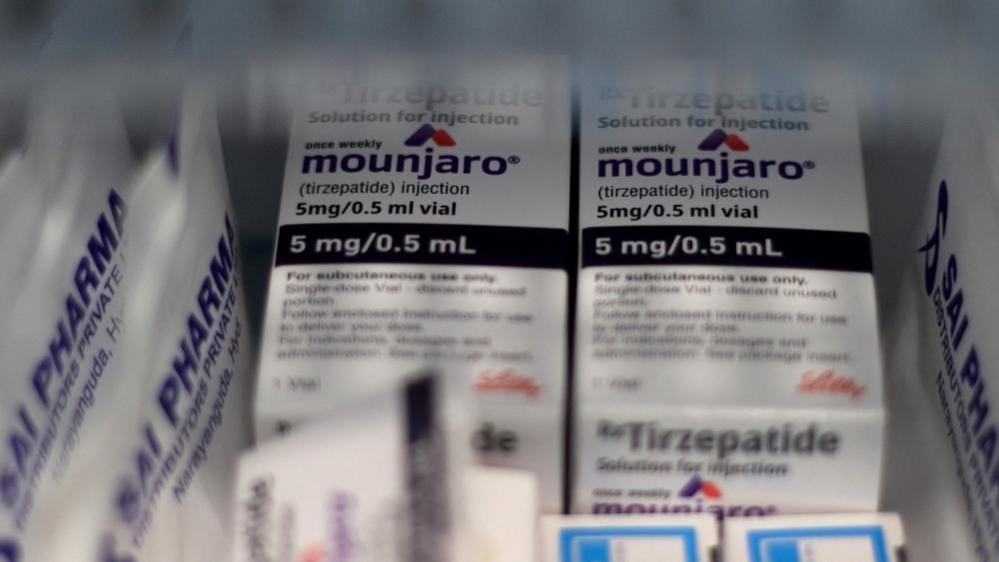An image of white medical boxes branded as Mounjaro.