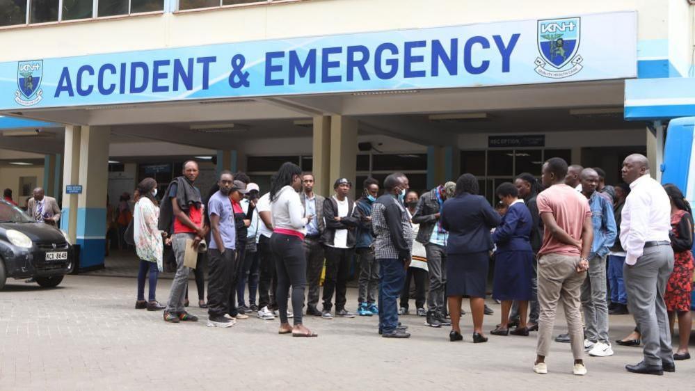 Relatives of victims injured during a protest on the previous day wait outside Kenyatta National Hospital in Nairobi, Kenya, 26 June 2024.