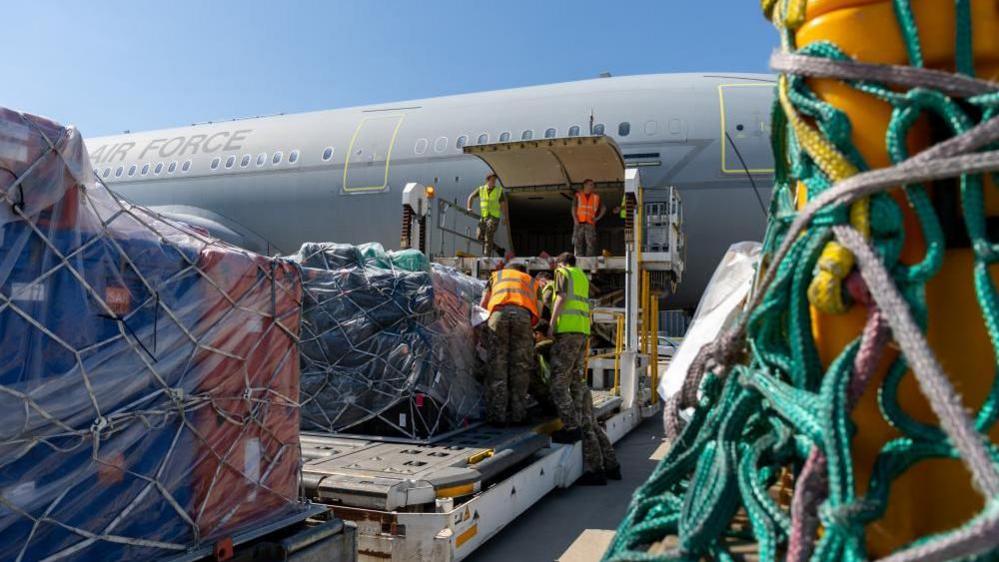 An RAF plane being loaded with supplies at Brize Norton