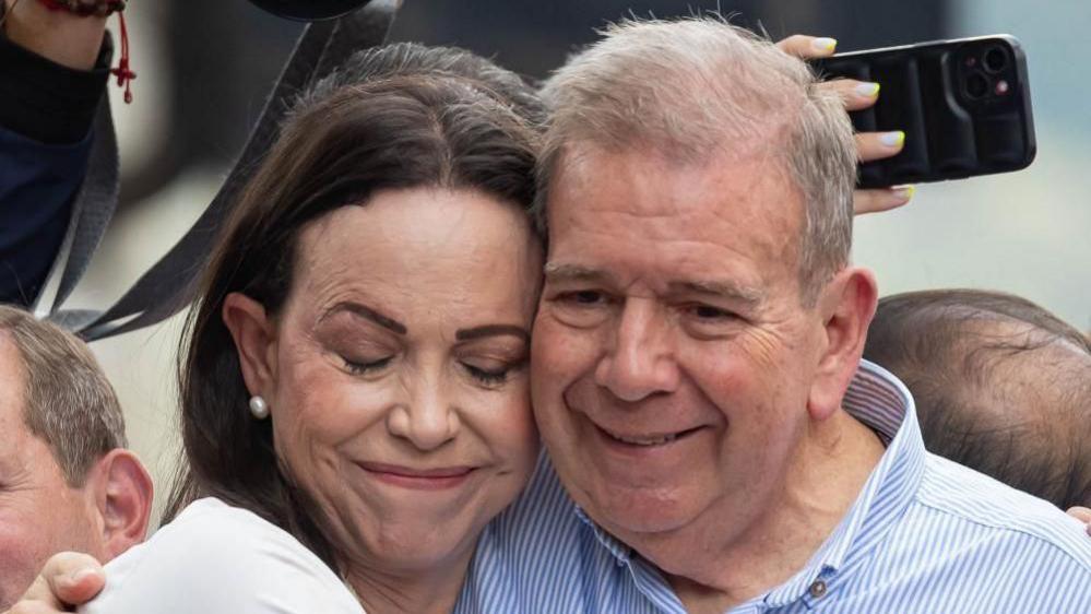 Venezuelan opposition leader Maria Corina Machado (L) hugs Venezuelan presidential candidate Edmundo Gonzalez Urrutia at a rally in Caracas, Venezuela, 30 July 2024.