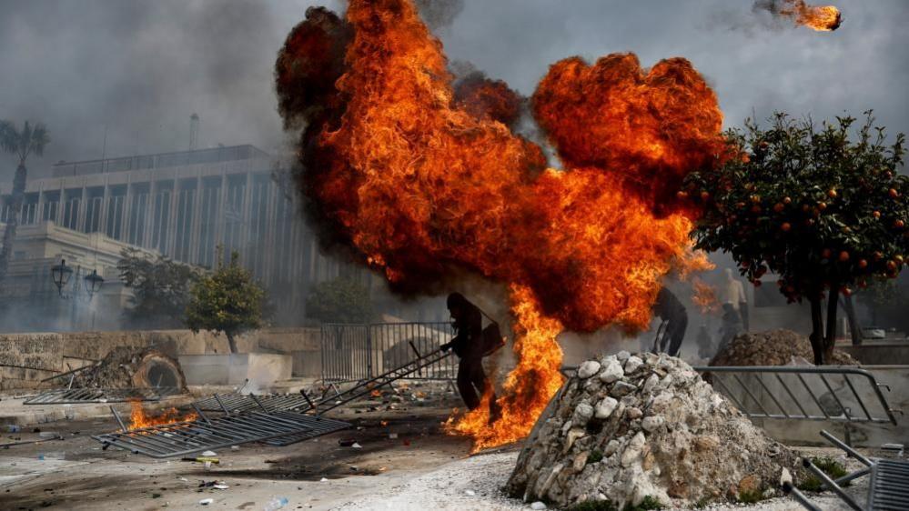 A petrol bomb explodes in Athens