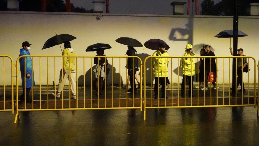 Police on the streets of Shanghai on Saturday