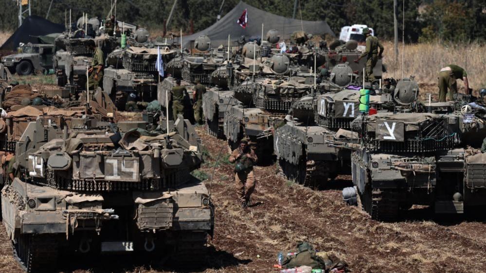 Israeli tanks assemble in the north of the country close to the border with Lebanon