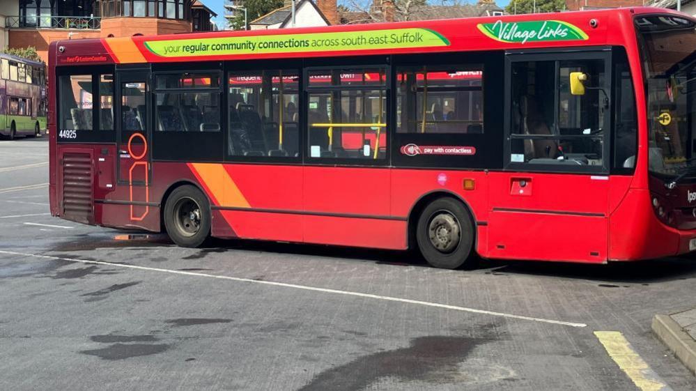 A First Bus parked at Ipswich Cattle Market bus station - it's a single decker and red