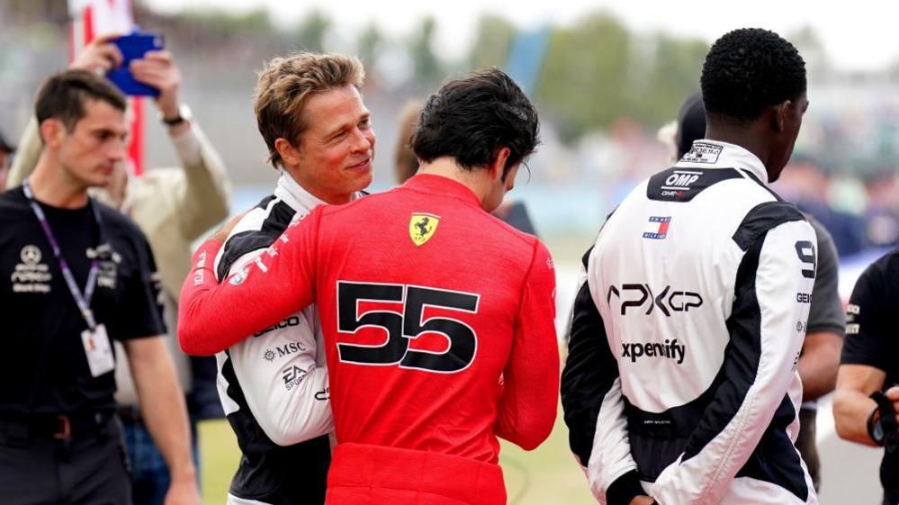 Brad Pitt greeting Carlos Sainz Jr at the British Grand Prix