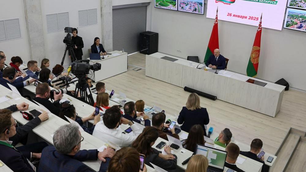 A handout picture made available by Belarus President press service shows Belarusian President Alexander Lukashenko (R) attending a press conference after casting his ballot in the presidential elections at a polling station in Minsk, Belarus, 26 January 2025