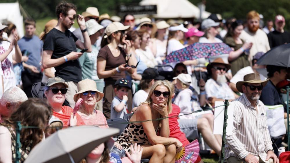 Visitors attend the Queen's Joust medieval jousting competition during a heatwave at Leeds Castle near Maidstone, on 23 May 2026