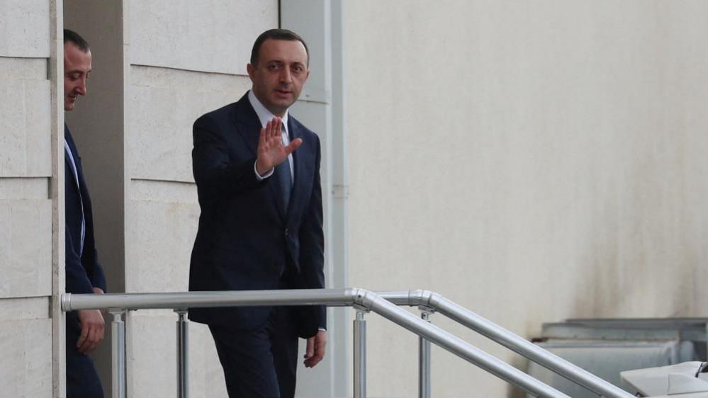 Former Georgian Prime Minister Irakli Garibashvili, charged with large-scale money laundering, leaves the courthouse after a hearing in Tbilisi, Georgia October 24, 2025.
