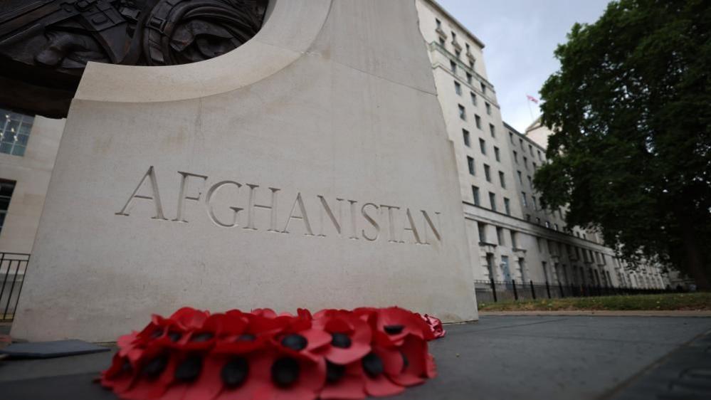 A monument inscribed with the word Afghanistan outside the headquarters of the Ministry of Defence in London