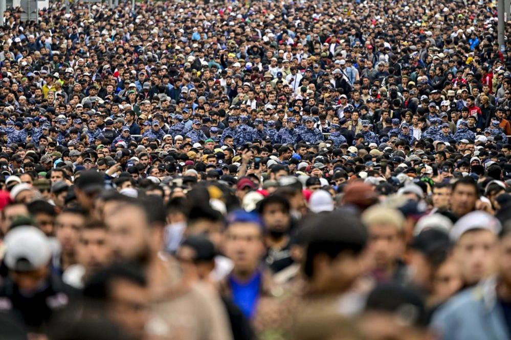 Muslims who could not find empty places in mosques in Russia's capital Moscow gather to pray on the streets