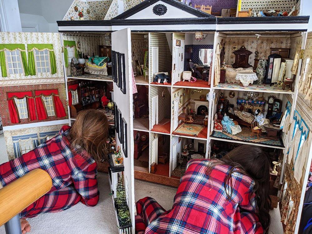 Children with a dolls house