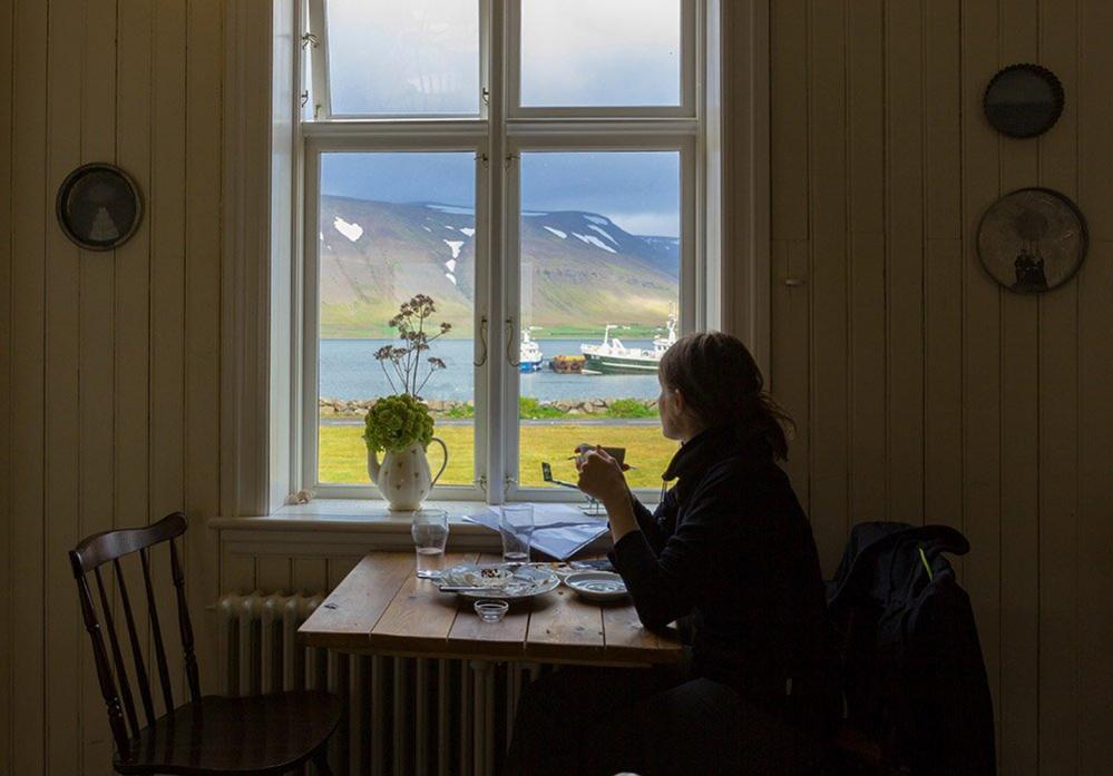 Woman looking out of a window