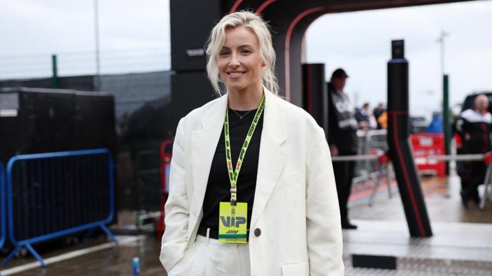 Leah Williamson in white suit smiling