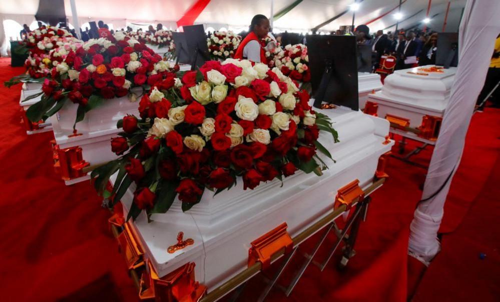 Kenya Red Cross workers arrange coffins before a memorial service in Kenya, September 26, 2024