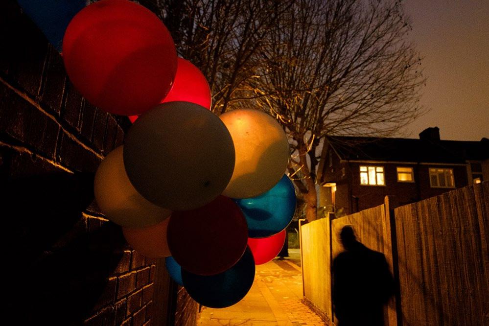 Balloons in an alleyway