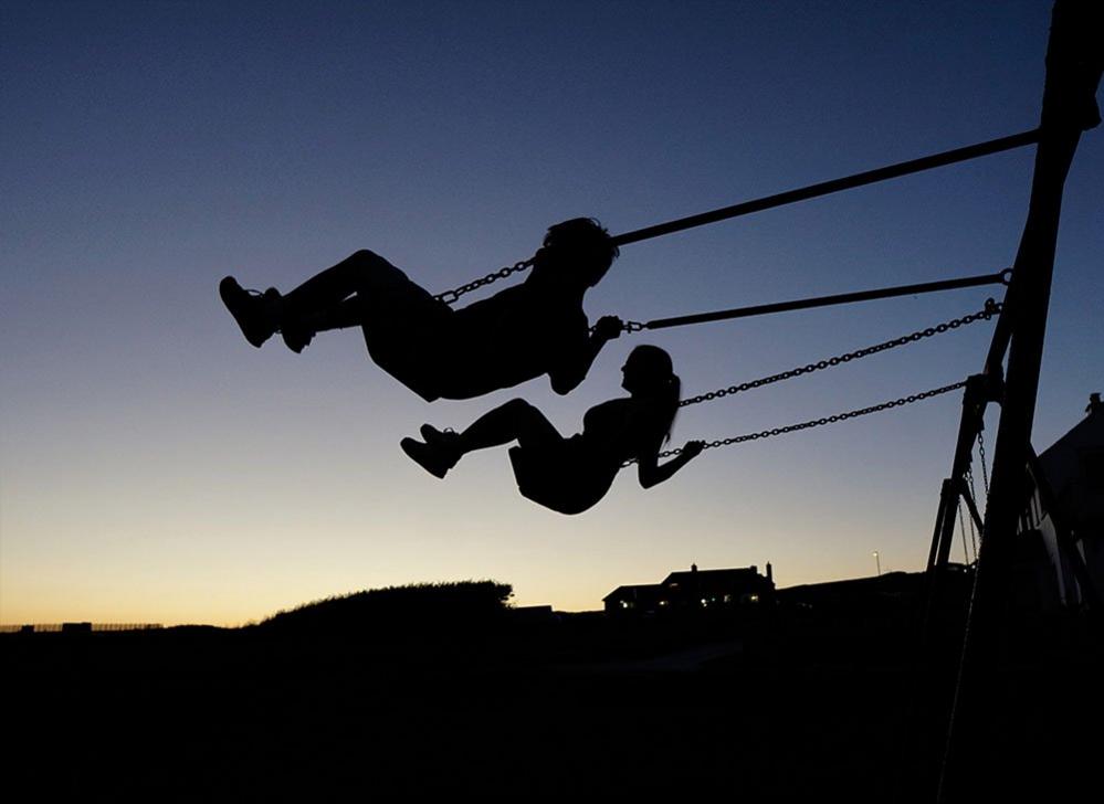 People on swings