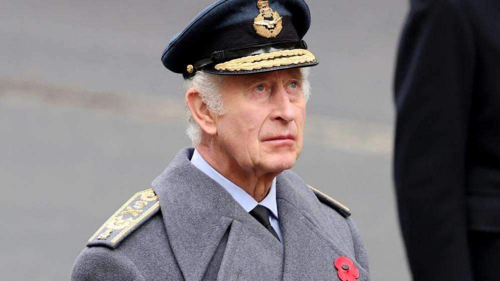 King Charles attends the Remembrance event at the Cenotaph, looking up