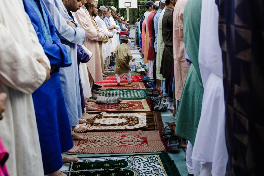 Dozens of Muslims pray to celebrate Eid al-Adha in the park of El Casino de Embajadores in Madrid, Spain