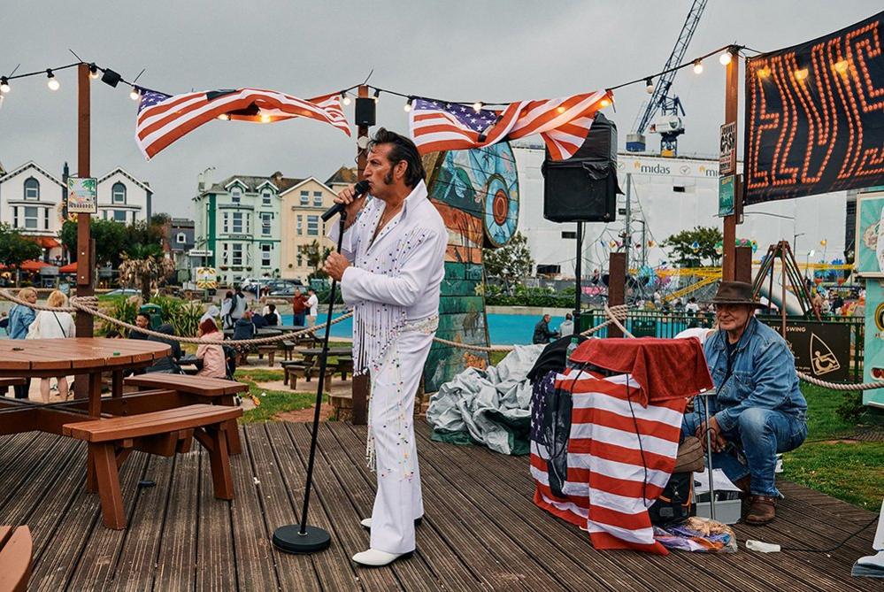 An Elvis impersonator sings during Elvis week at the Geo Park Cafe in Paignton