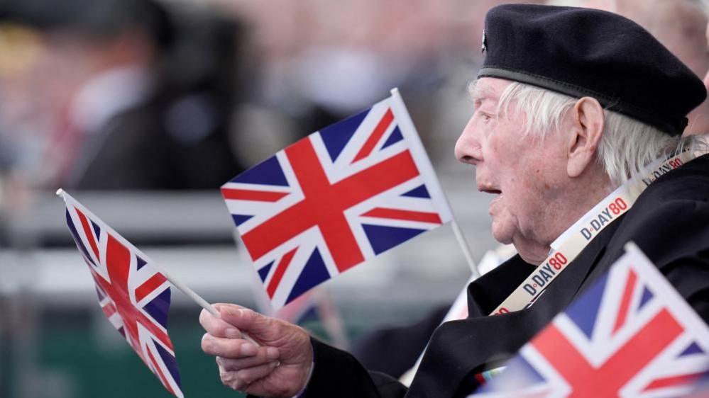 A veteran waves a flag