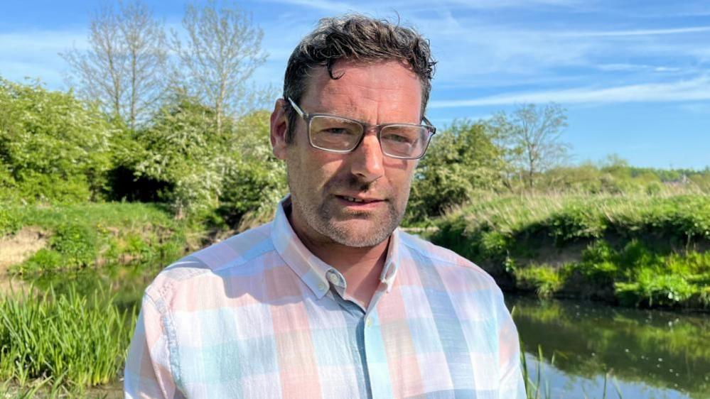 Seamus Sullivan stood near the River Erewash on land which he owns.