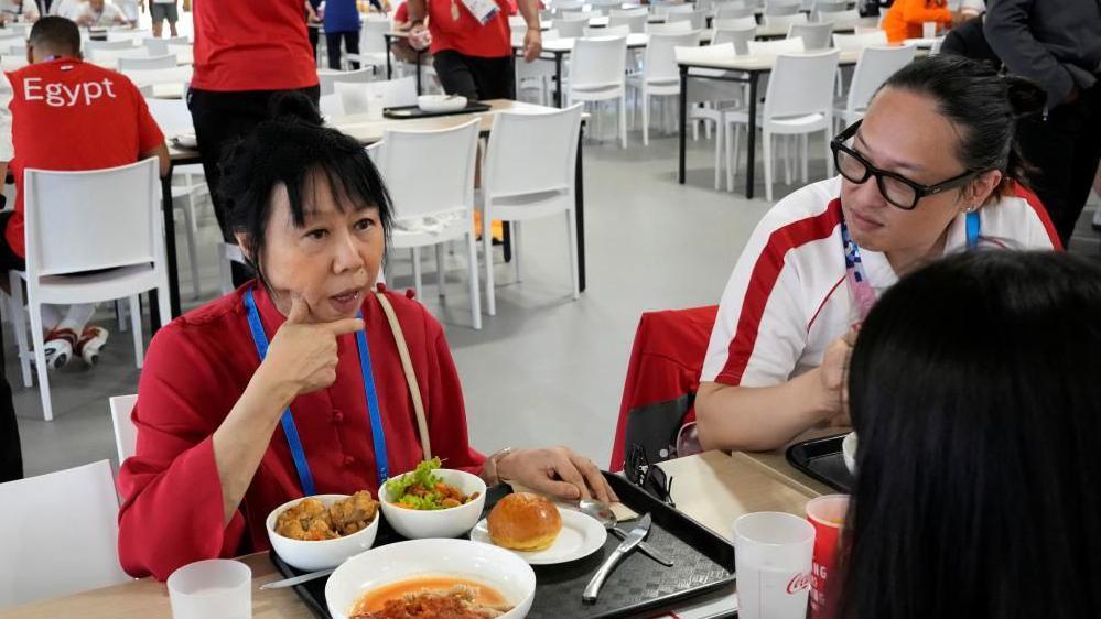 Singapore President Tharman Shanmugaratnam and his wife Jane Yumiko Ittogi share a lunch with Singapore athletes during his visit at the Olympic Village